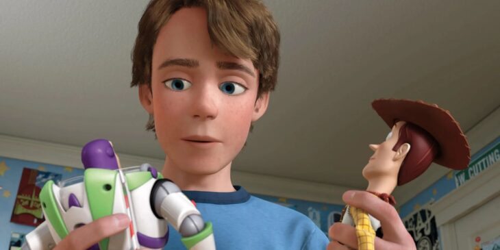 Andy com Buzz e Woody em Toy Story