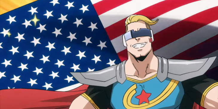 Captain Celebrity sorrindo em frente a bandeira dos EUA em cena do Episódio 8 de My Hero Academia: Vigilantes