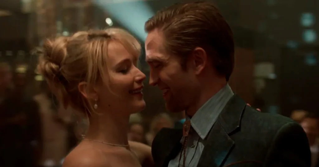 Jennifer Lawrence e Robert Pattinson em Morra, Amor