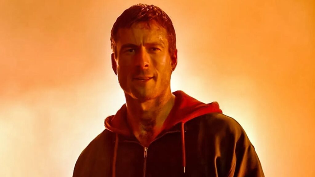 Glen Powell em cenário de O Sobrevivente