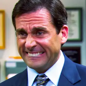 Steve Carrell com expressão engraçada no rosto em The Office